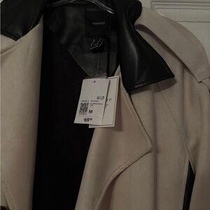 Forever21 coat. Never worn. Color is Black & Ivory